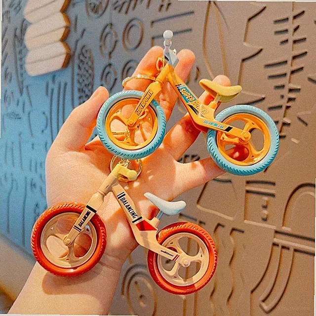 Plastic Cartoon Movable and Sliding Bicycle Couple Accessories Keychain Pendant